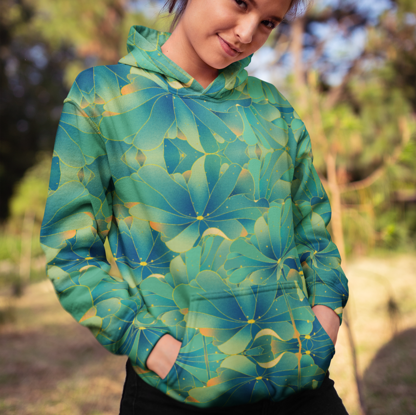 Water Lettuce Green Beach Hoodie, a cozy unisex sweatshirt with a vibrant green and turquoise water lettuce print, soft cotton-feel fabric, and brushed fleece lining, perfect for beach strolls and lounging.