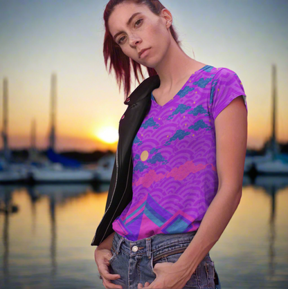Lady wearing the Chameleon Surf Japan Sky Reflective Mountains Purple Women's T-shirt, featuring a vibrant blend of purples, pinks, and turquoise in a stunning reflective mountain design. This super smooth and comfortable T-shirt, crafted from cotton-touch polyester jersey, offers unmatched comfort and stays fresh after multiple washes. Perfect for any season, this stylish tee captures the essence of both summer and fall.